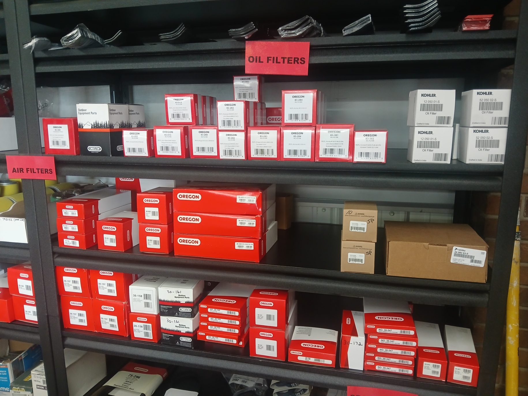 Shelves of Oregon oil and air filters, blades and parts at Tool Shed Rentals