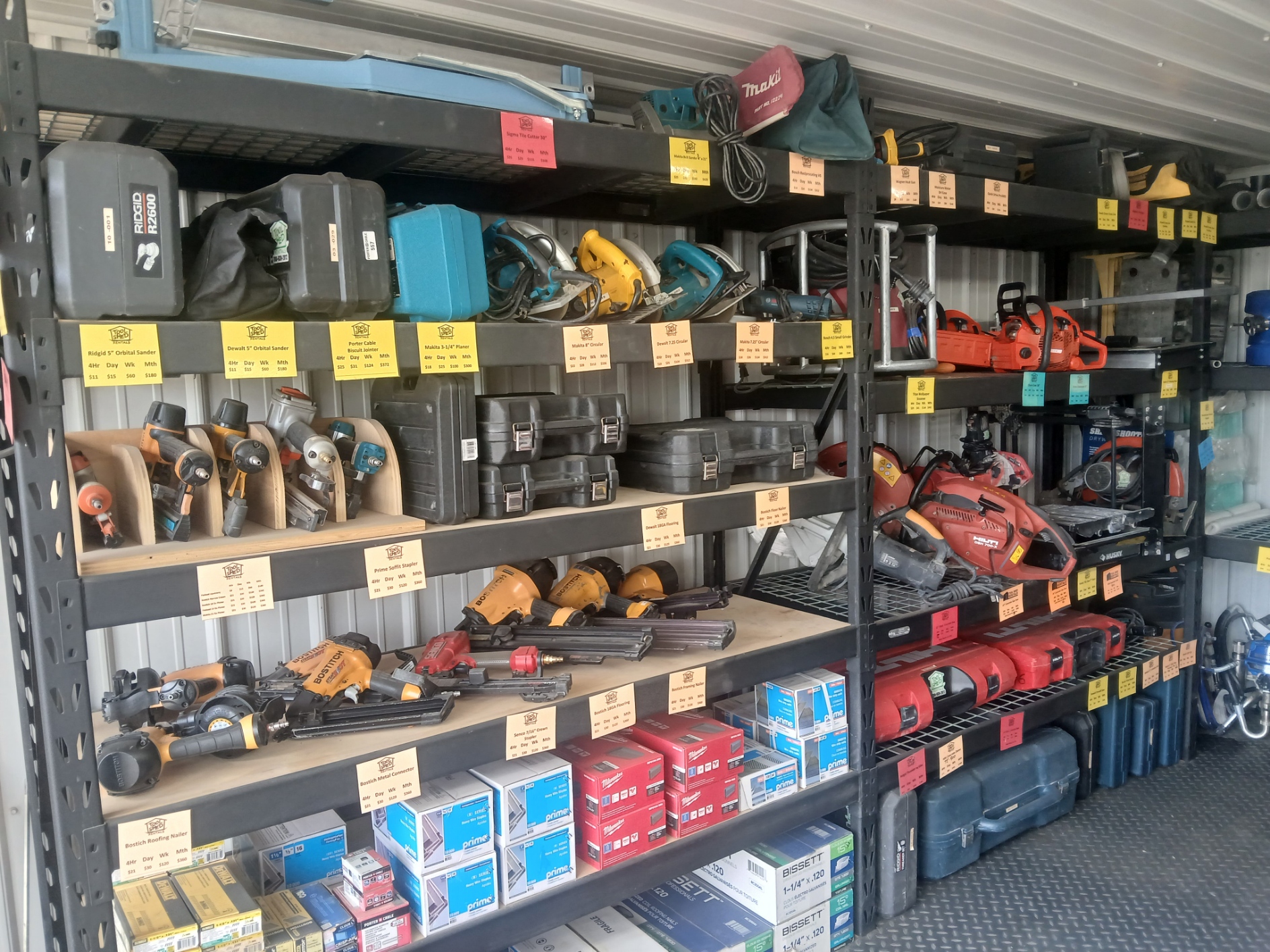 Rental shelves stocked with saws, sanders, nailers and power tools